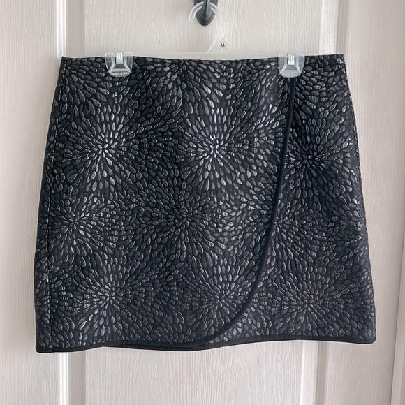 Black with metallic-like thread patterned faux-wrap skirt. Size 12. - Picture 1 of 3